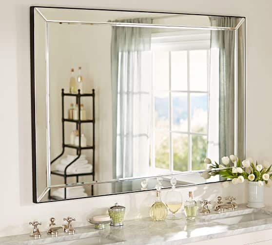 a bathroom vanity and mirror