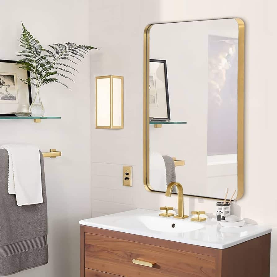the bathroom vanity and mirror